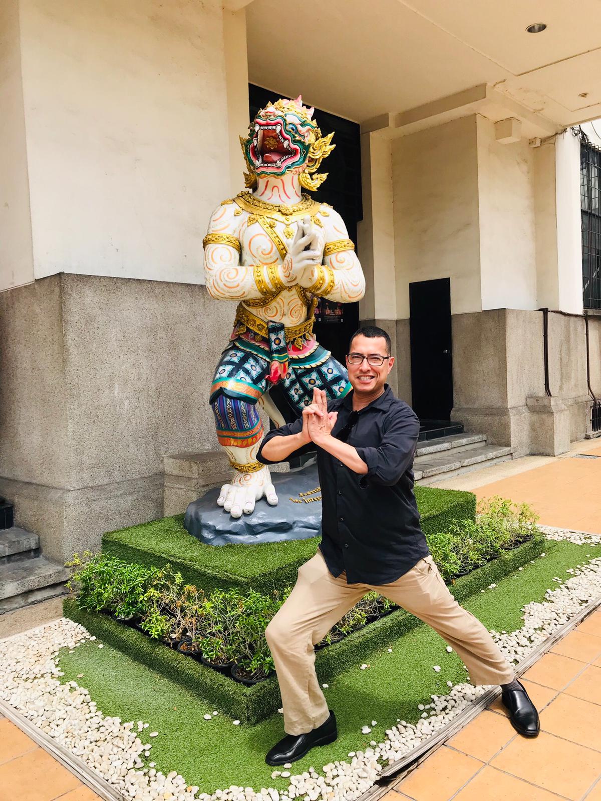 Me posing in front of Thai statue